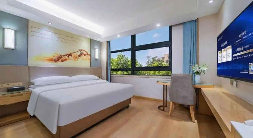 Bed in Vienna Hotel Chongqing Shiqiaopu Metro Station