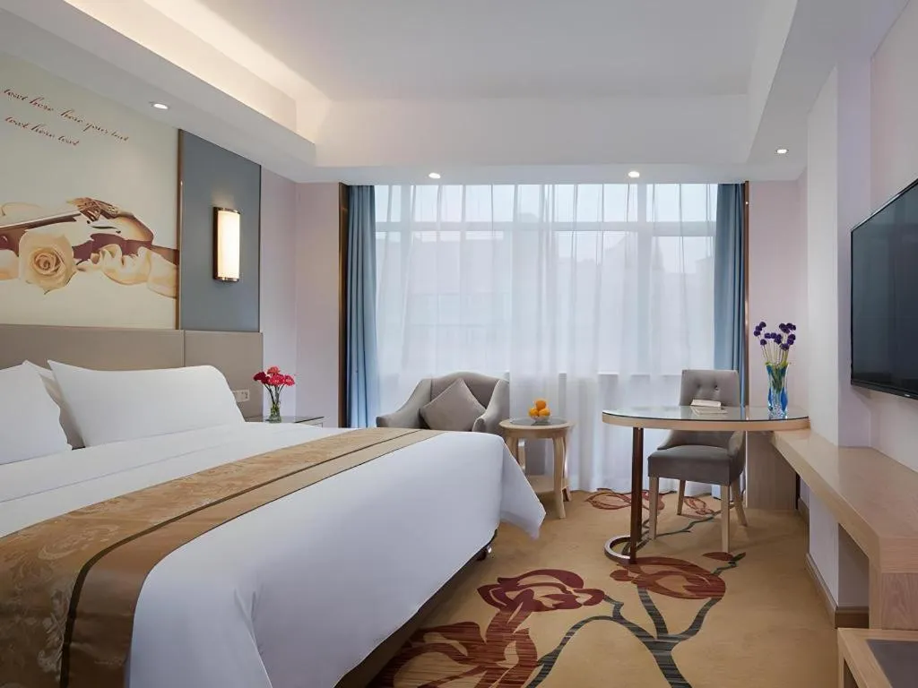 Bed in Vienna Hotel Chongqing Shiqiaopu Metro Station