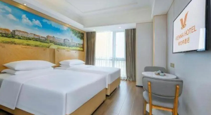 Bed in Vienna Hotel Chongqing Yangjiaping Pedestrian Street Light Railway Station