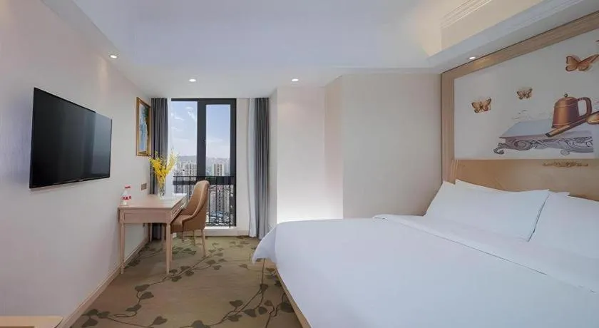 Bed in Vienna Hotel Chongqing Yangjiaping Pedestrian Street Light Railway Station