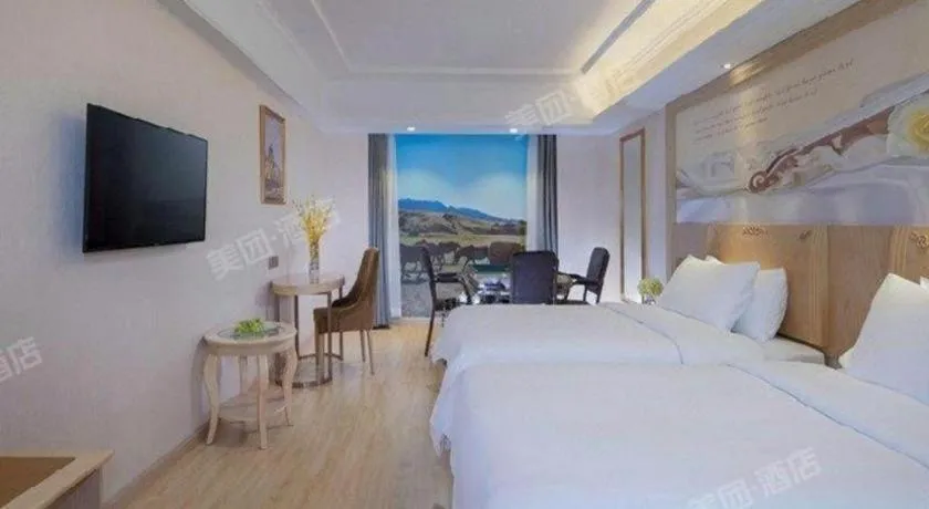 Bed in Vienna Hotel Chongqing Yangjiaping Pedestrian Street Light Railway Station