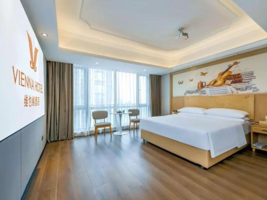 Bed in Vienna Hotel Chongqing Yangjiaping Pedestrian Street Light Railway Station