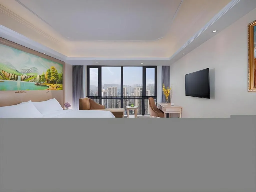 Bed in Vienna Hotel Chongqing Yangjiaping Pedestrian Street Light Railway Station