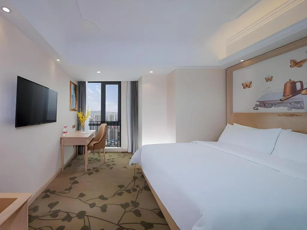 Bed in Vienna Hotel Chongqing Yangjiaping Pedestrian Street Light Railway Station