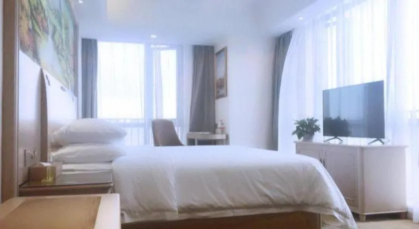 Bed in Vienna Hotel Chongqing Yangjiaping Pedestrian Street Light Railway Station