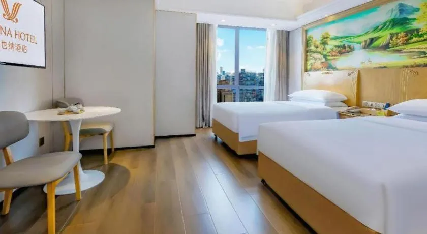 Bed in Vienna Hotel Chongqing Yangjiaping Pedestrian Street Light Railway Station