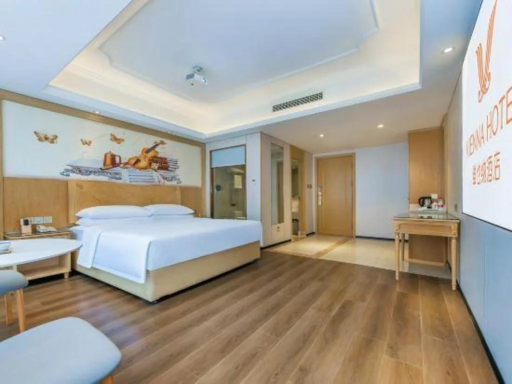 Bed in Vienna Hotel Chongqing Yangjiaping Pedestrian Street Light Railway Station