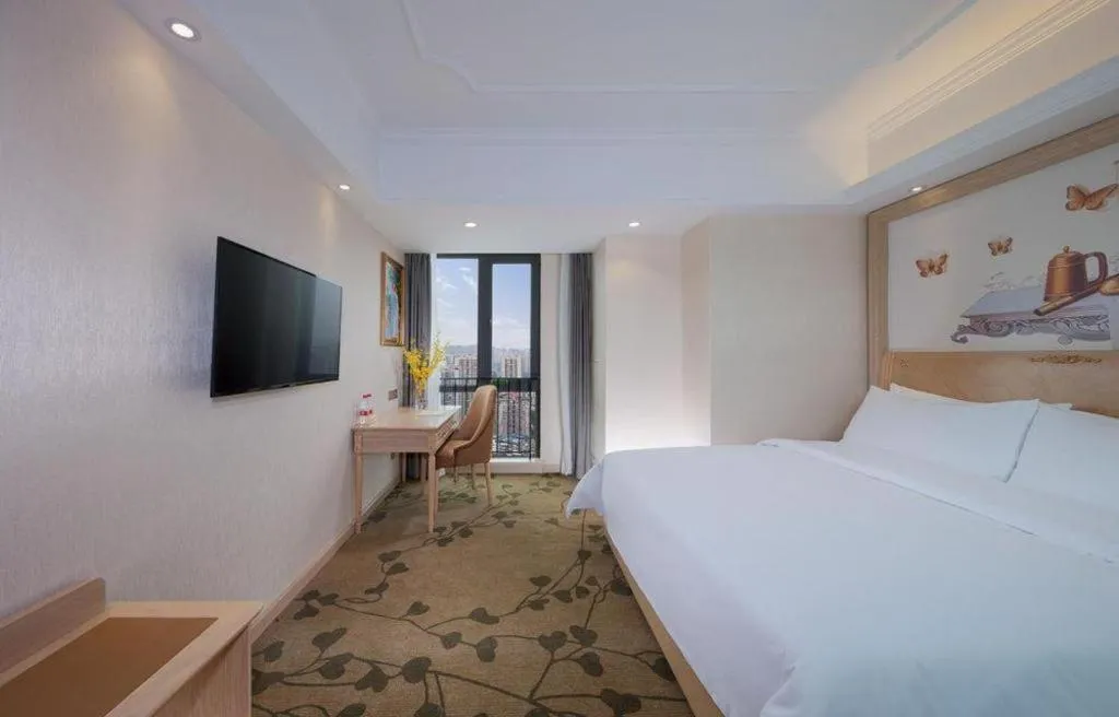 Bed in Vienna Hotel Chongqing Yangjiaping Pedestrian Street Light Railway Station