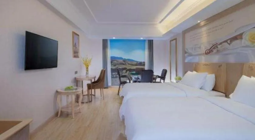 Bed in Vienna Hotel Chongqing Yangjiaping Pedestrian Street Light Railway Station