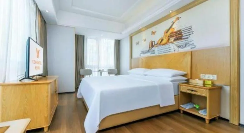 Bed in Vienna Hotel Chongqing Yangjiaping Pedestrian Street Light Railway Station