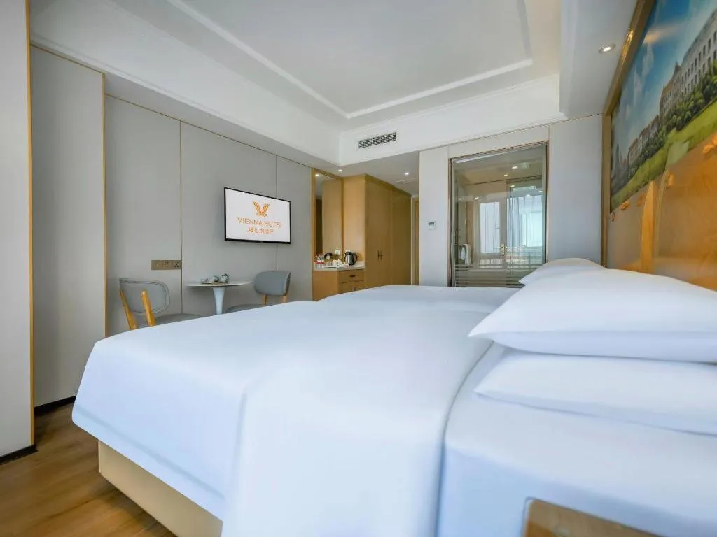 Bed in Vienna Hotel Chongqing Yangjiaping Pedestrian Street Light Railway Station