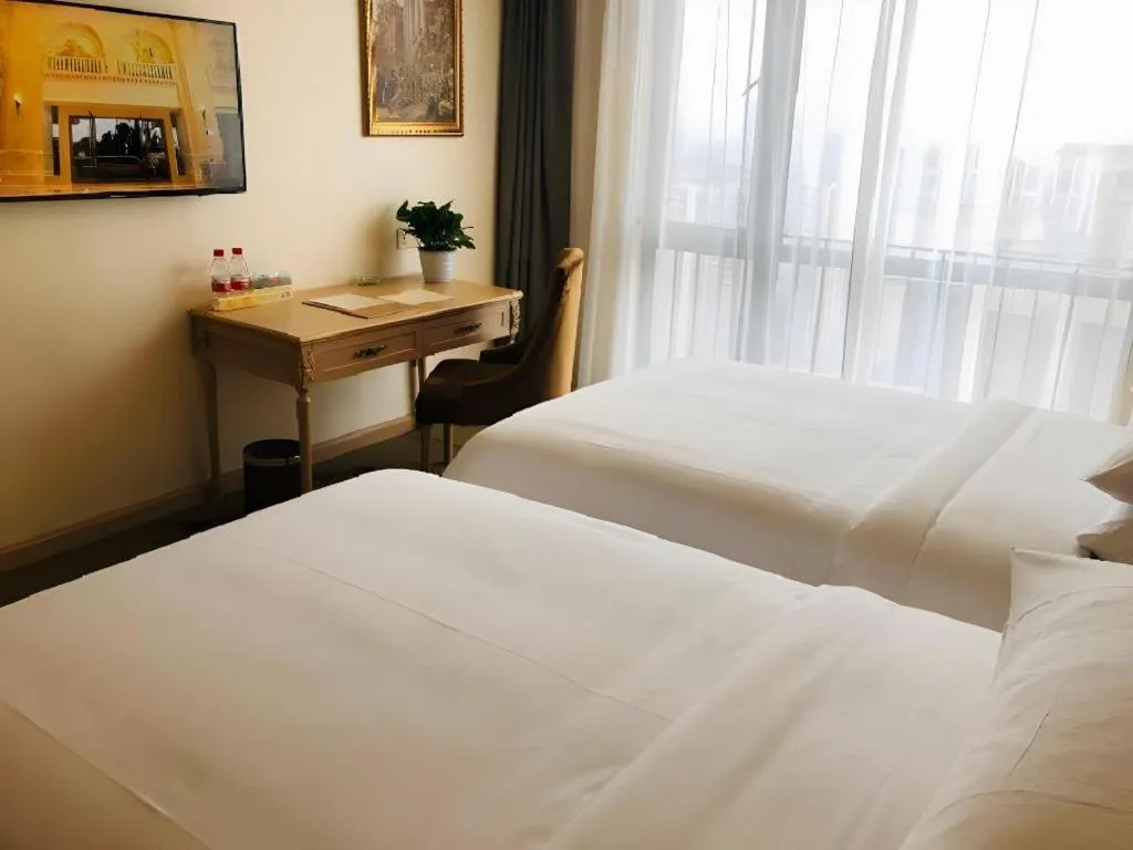 Bed in Vienna Hotel Chongqing Yangjiaping Pedestrian Street Light Railway Station