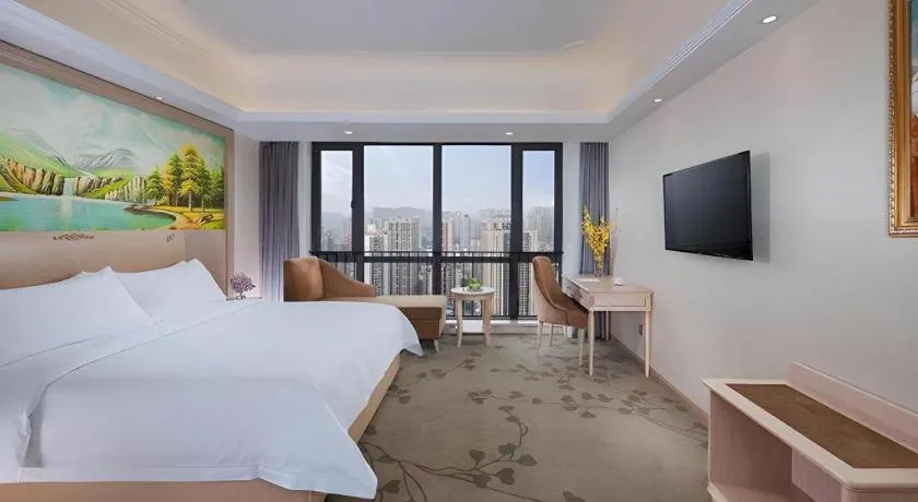 Bed in Vienna Hotel Chongqing Yangjiaping Pedestrian Street Light Railway Station