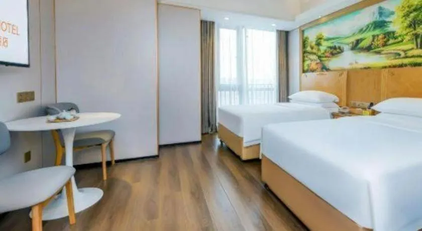 Bed in Vienna Hotel Chongqing Yangjiaping Pedestrian Street Light Railway Station