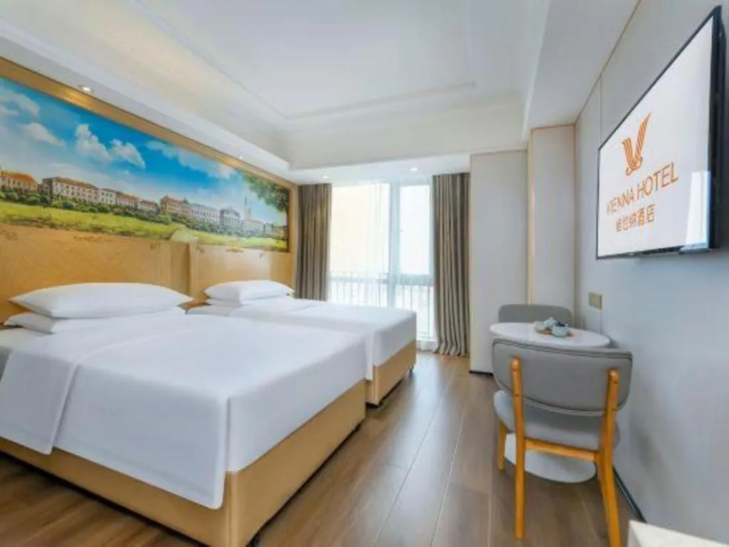 Bed in Vienna Hotel Chongqing Yangjiaping Pedestrian Street Light Railway Station