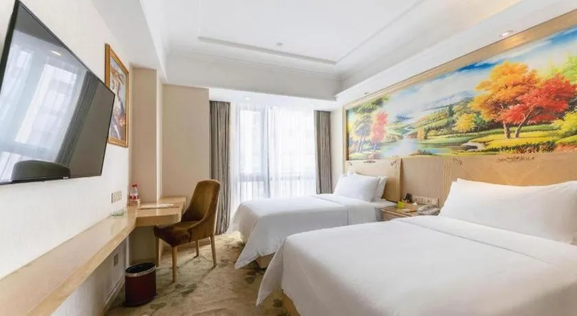 Bed in Vienna Hotel Chongqing Yangjiaping Pedestrian Street Light Railway Station