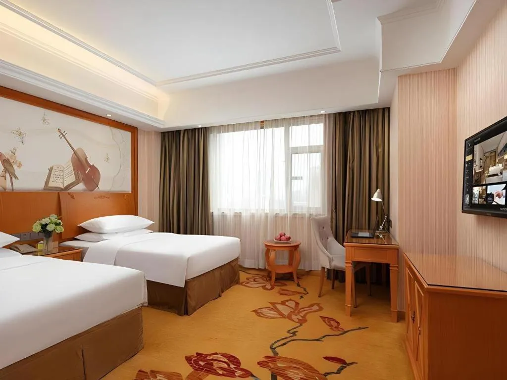 Bed in Vienna Hotel Xi'an Xijing Hospital Tonghuamen Metro Station