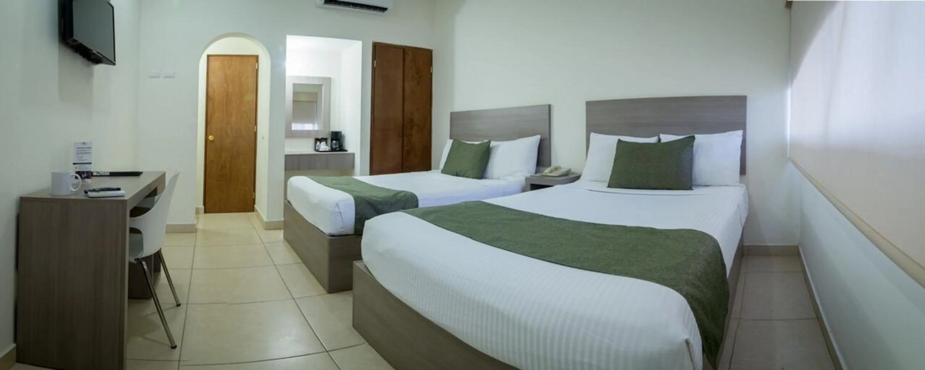 Bedroom in Hotel La Riviera