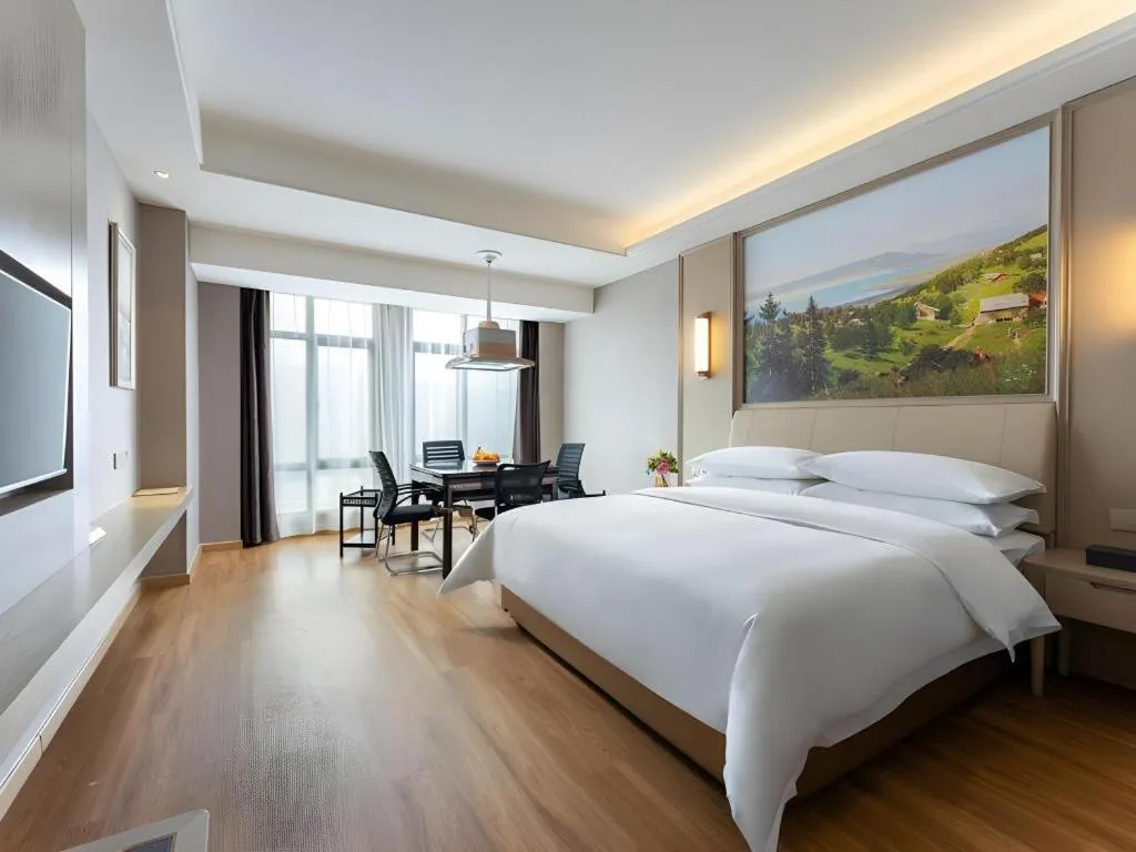 Bed in Vienna Hotel Jiangxi Fuzhou Yihuang