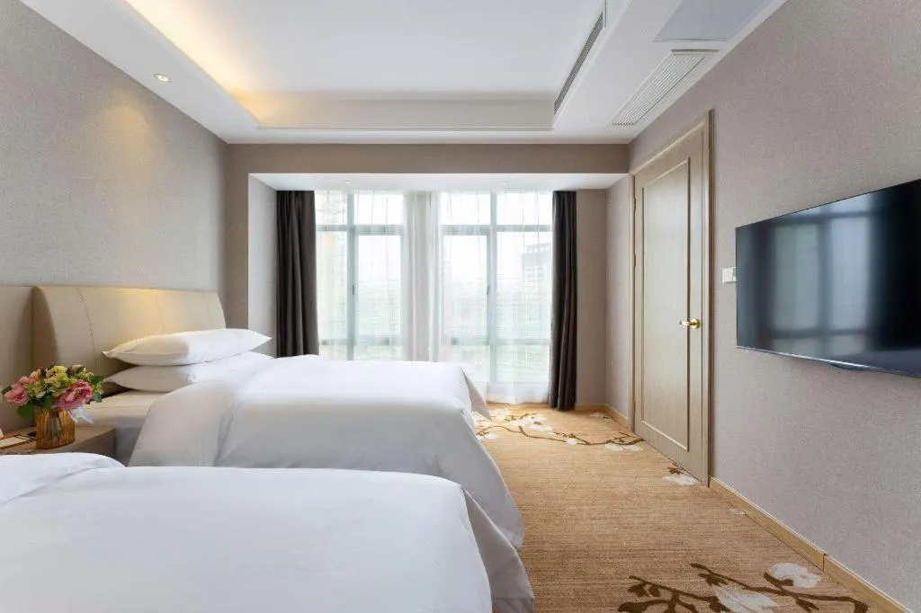 Bed in Vienna Hotel Jiangxi Fuzhou Yihuang