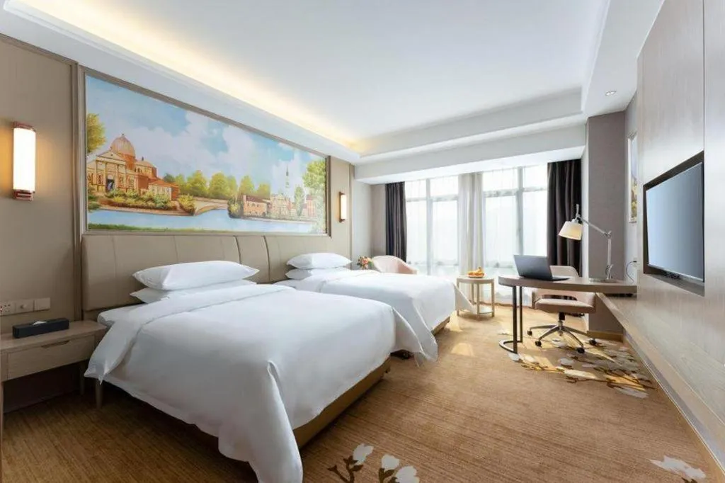 Bed in Vienna Hotel Jiangxi Fuzhou Yihuang