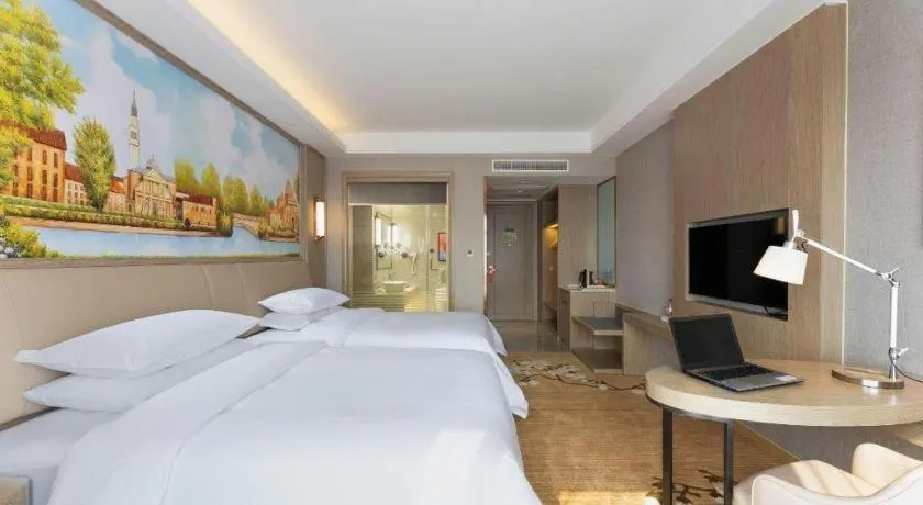 Bed in Vienna Hotel Jiangxi Fuzhou Yihuang