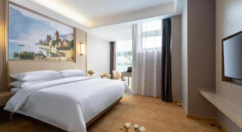 Bed in Vienna Hotel Jiangxi Fuzhou Yihuang