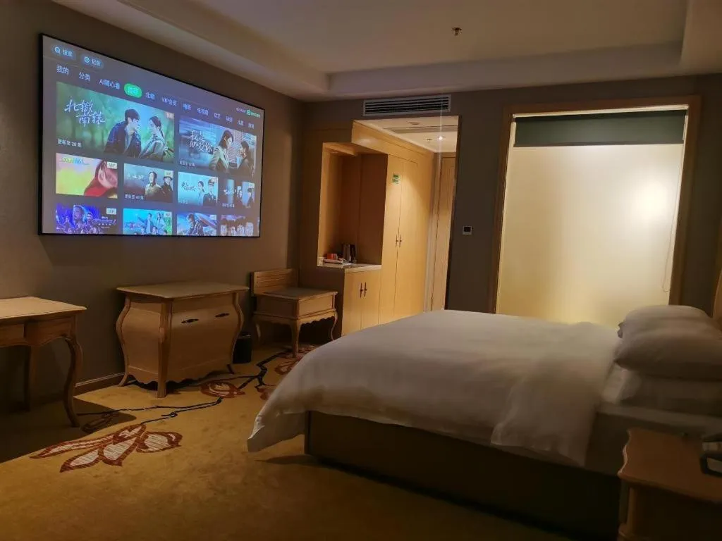 Bed in Vienna Hotel Jiangxi Fuzhou Yihuang