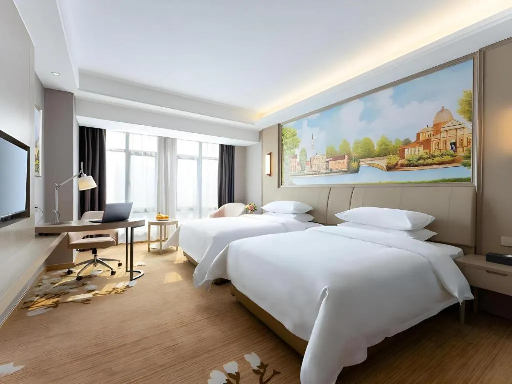 Bed in Vienna Hotel Jiangxi Fuzhou Yihuang