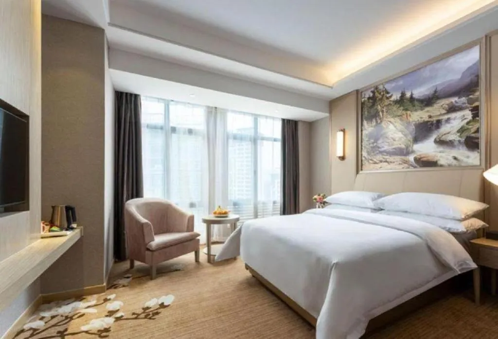 Bed in Vienna Hotel Jiangxi Fuzhou Yihuang