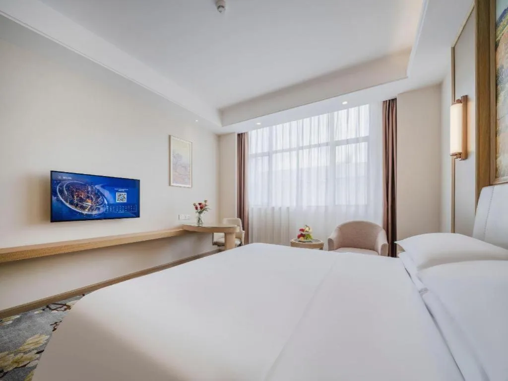 Bed in Vienna Hotel Shenzhen Pingshan Longtian Town