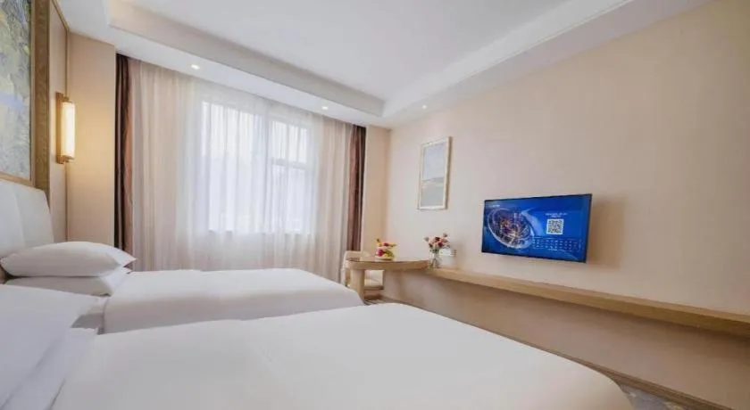 Bed in Vienna Hotel Shenzhen Pingshan Longtian Town