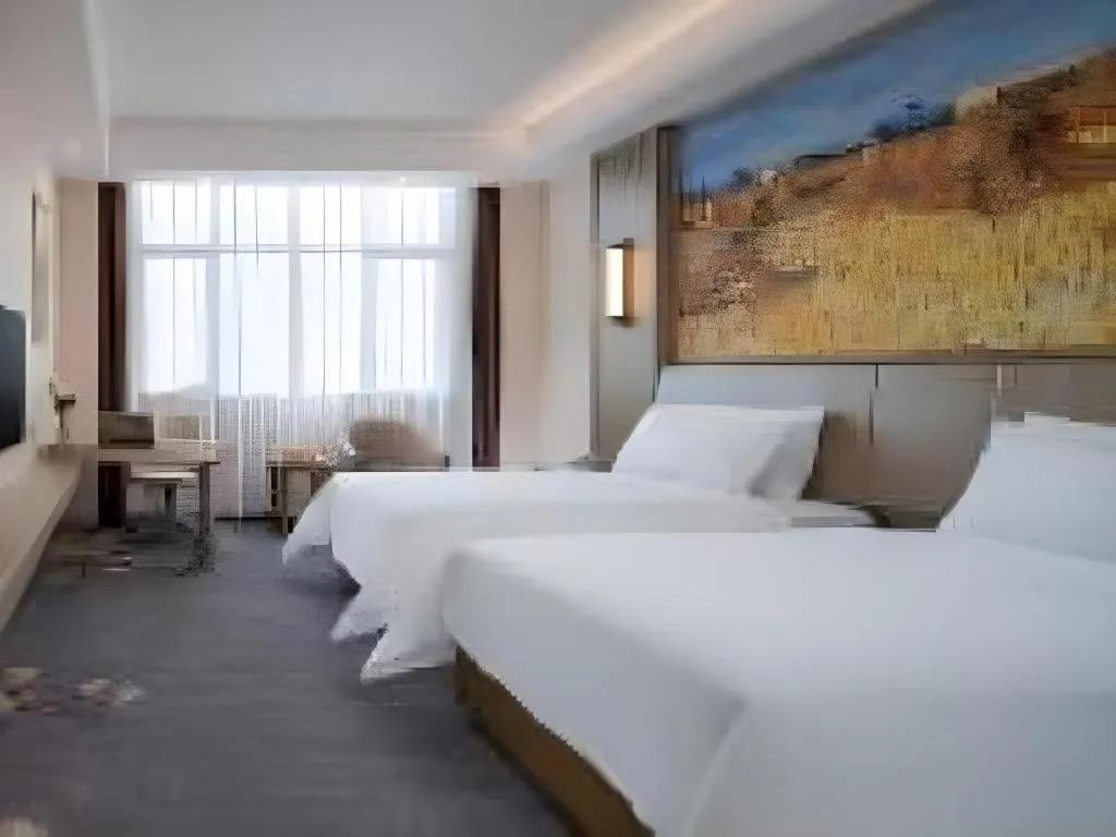 Bed in Vienna Hotel Shenzhen Pingshan Longtian Town
