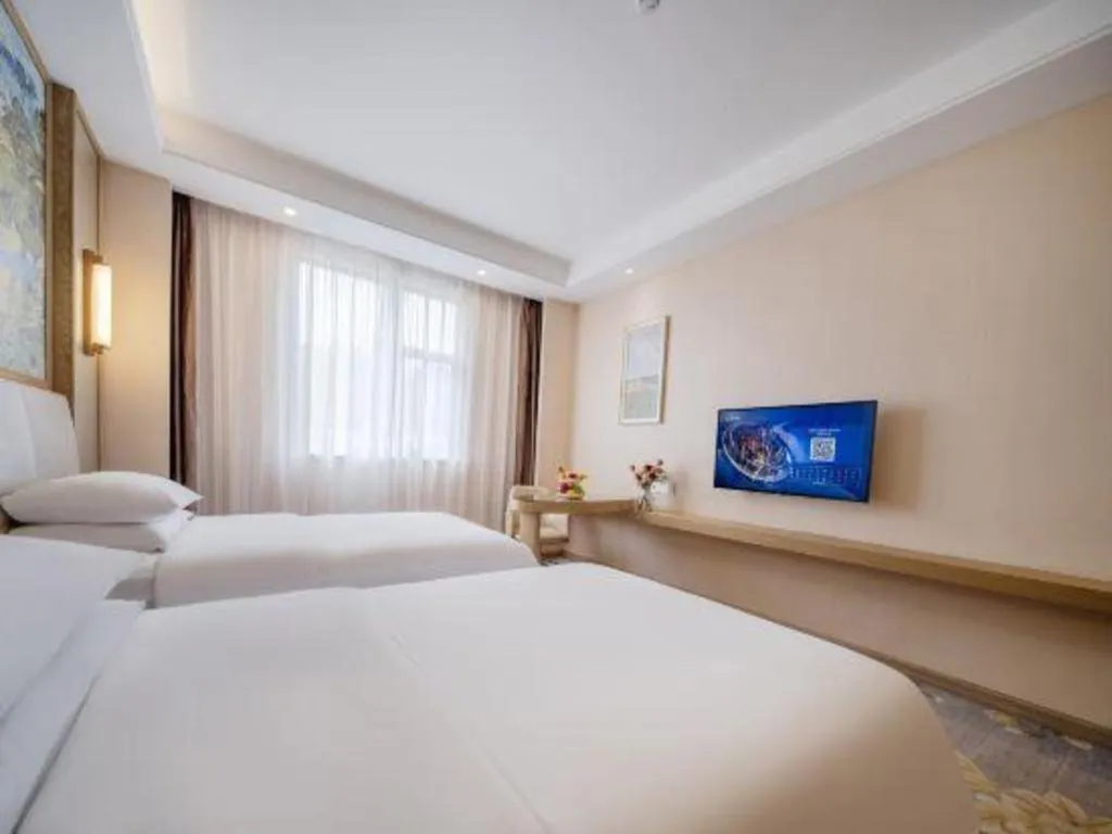 Bed in Vienna Hotel Shenzhen Pingshan Longtian Town