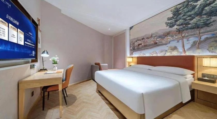 Bed in Vienna Hotel Chongqing Wushan Municipal Government