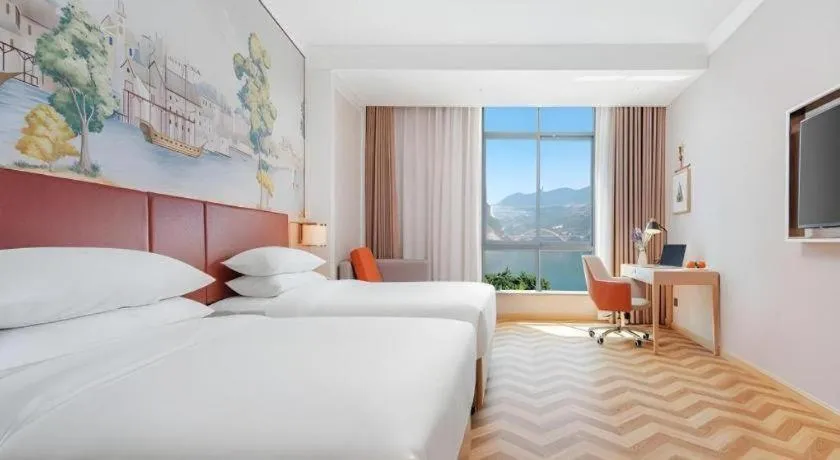 Bed in Vienna Hotel Chongqing Wushan Municipal Government