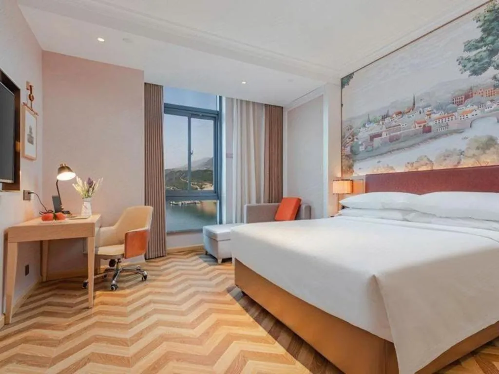 Bed in Vienna Hotel Chongqing Wushan Municipal Government