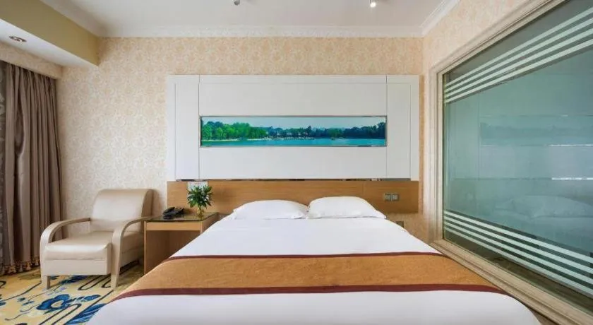 Bed in Vienna Hotel Guangdong Zhuhai Mingzhu Station Guozheng