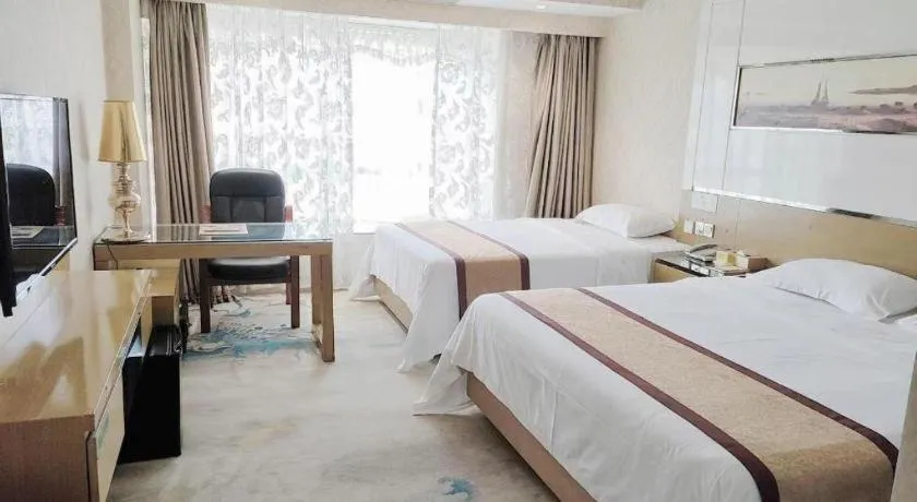 Bed in Vienna Hotel Guangdong Zhuhai Mingzhu Station Guozheng