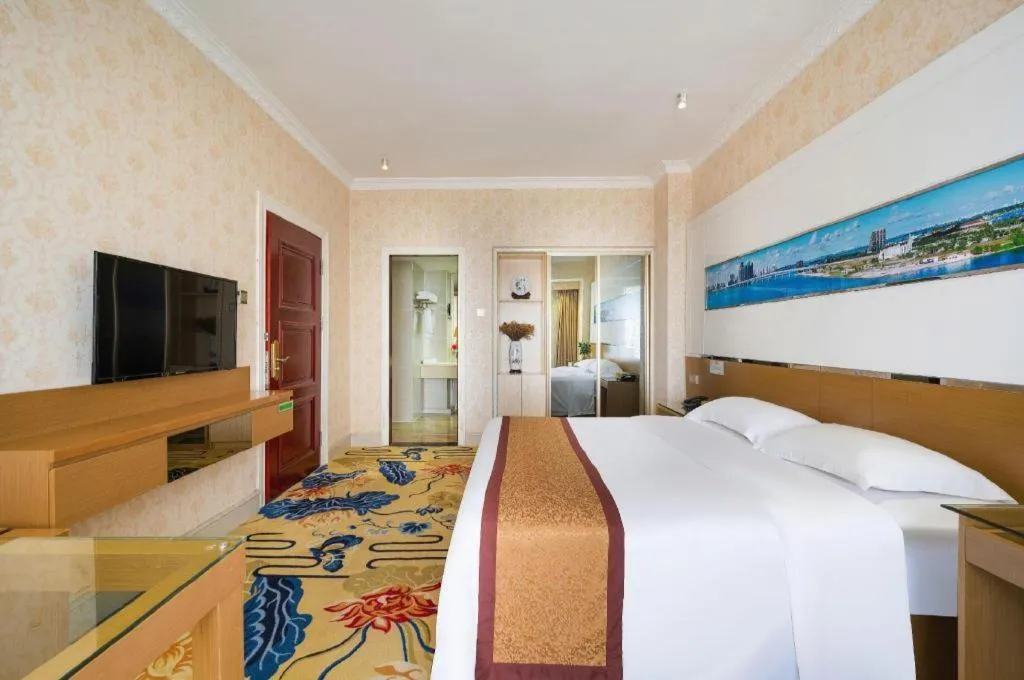 Bed in Vienna Hotel Guangdong Zhuhai Mingzhu Station Guozheng