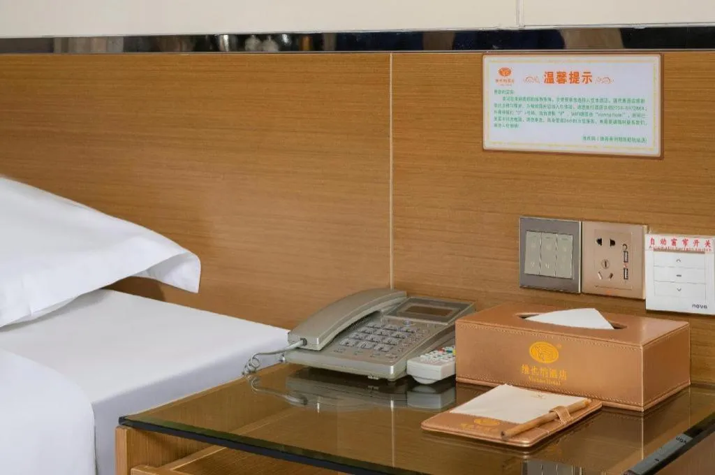 Bed in Vienna Hotel Guangdong Zhuhai Mingzhu Station Guozheng