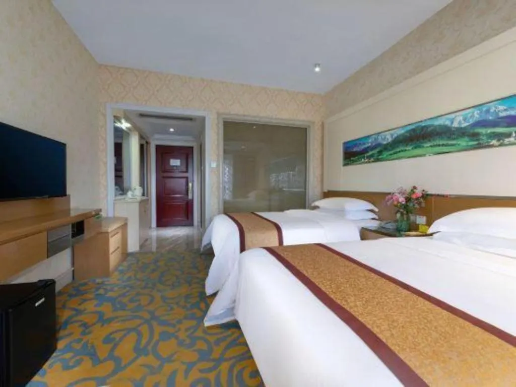 Bed in Vienna Hotel Guangdong Zhuhai Mingzhu Station Guozheng