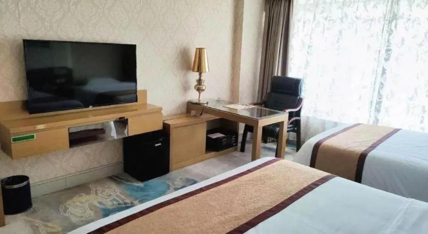 Bed in Vienna Hotel Guangdong Zhuhai Mingzhu Station Guozheng