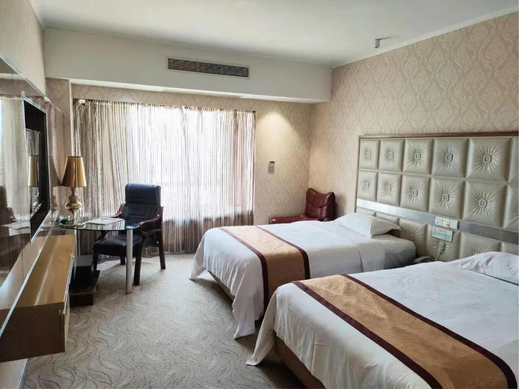 Bed in Vienna Hotel Guangdong Zhuhai Mingzhu Station Guozheng