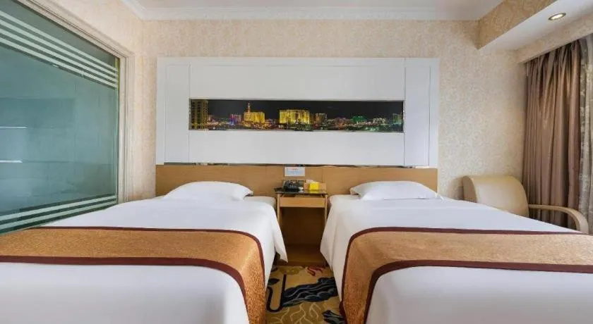Bed in Vienna Hotel Guangdong Zhuhai Mingzhu Station Guozheng