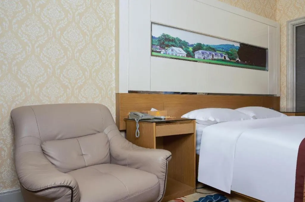 Bed in Vienna Hotel Guangdong Zhuhai Mingzhu Station Guozheng