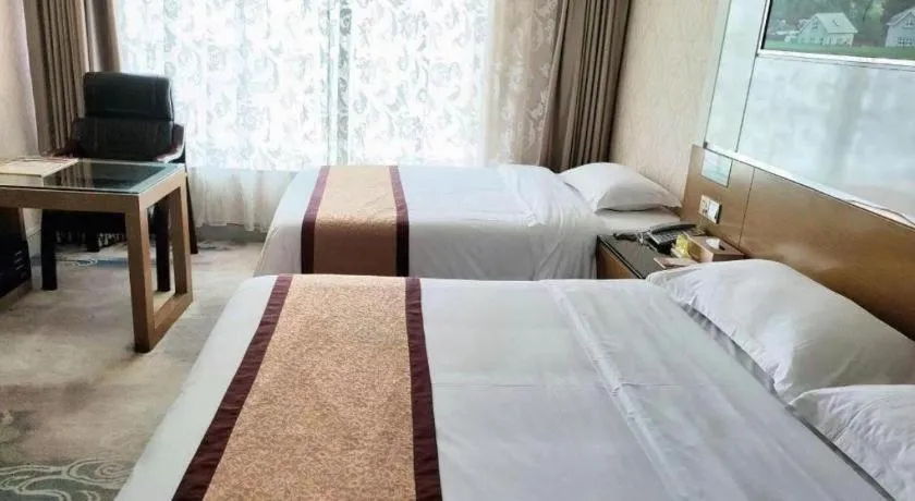 Bed in Vienna Hotel Guangdong Zhuhai Mingzhu Station Guozheng