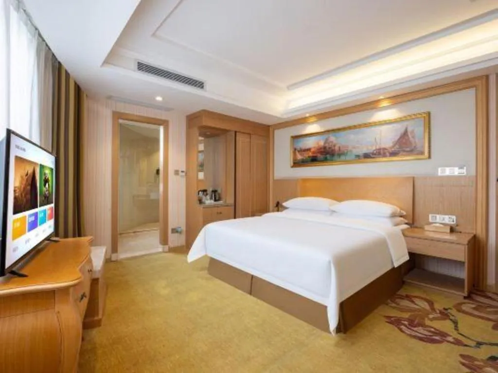 Bed in Vienna Hotel Guangzhou Baiyun Airport Huadu Avenue