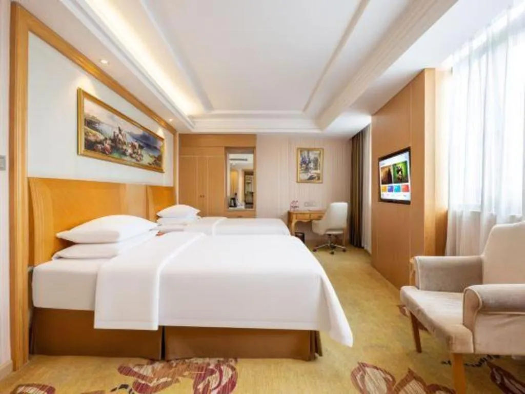 Bed in Vienna Hotel Guangzhou Baiyun Airport Huadu Avenue
