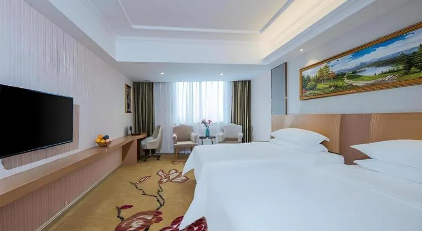Bed in Vienna Hotel Guangzhou Baiyun Airport Huadu Avenue